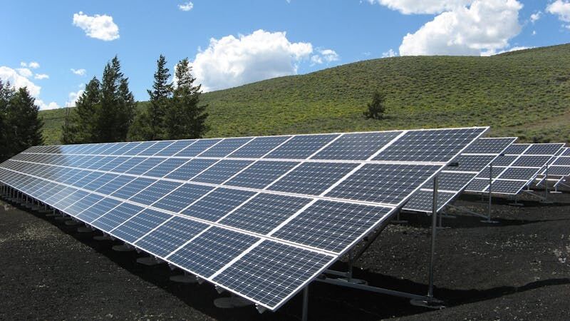 Ground-mounted solar array on a hillside